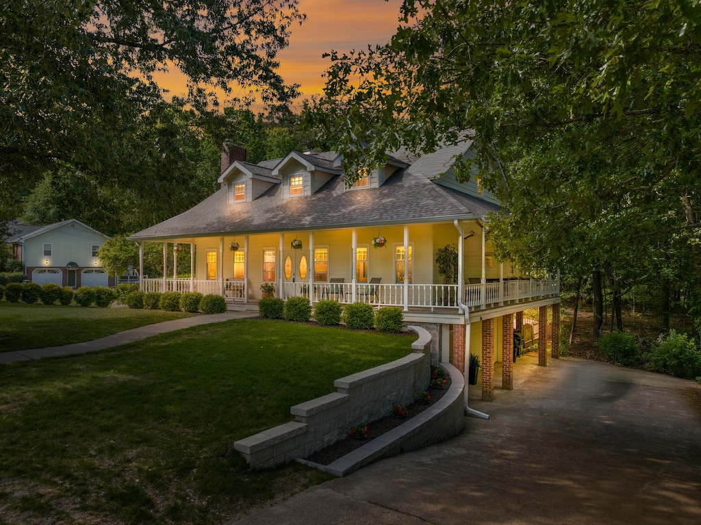 5306 Kellys Pt, Ooltewah, TN 37363 - farmhouse with a porch, driveway, a front yard, and a chimney