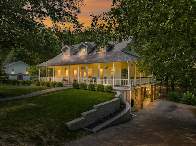 5306 Kellys Pt, Ooltewah, TN 37363 - farmhouse with a porch, driveway, a front yard, and a chimney