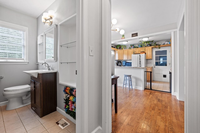5007 Florida Ave, Chattanooga, TN 37409 - bathroom with toilet, vanity, baseboards, and tile patterned floors