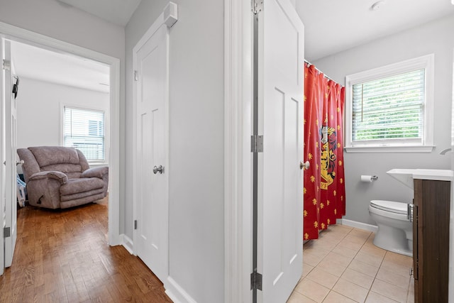 5007 Florida Ave, Chattanooga, TN 37409 - full bath with toilet, baseboards, wood finished floors, vanity, and curtained shower