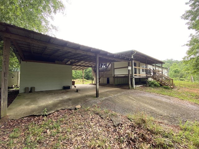 1237 N Pass, Chatsworth, GA 30705 - view of vehicle parking with an attached carport and stairs