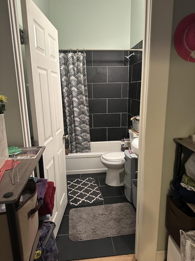 full bathroom featuring tile patterned flooring, toilet, and shower / bath combo