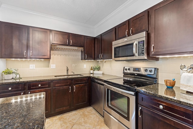 1131 Stringers Ridge Rd Unit 11G, Chattanooga, TN 37405 - kitchen featuring appliances with stainless steel finishes, a sink, backsplash, dark stone countertops, and crown molding