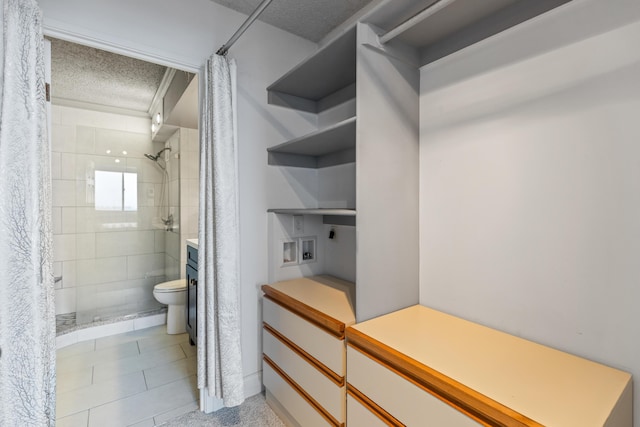 1131 Stringers Ridge Rd Unit 11G, Chattanooga, TN 37405 - full bathroom with a textured ceiling, toilet, a shower stall, and tile patterned flooring