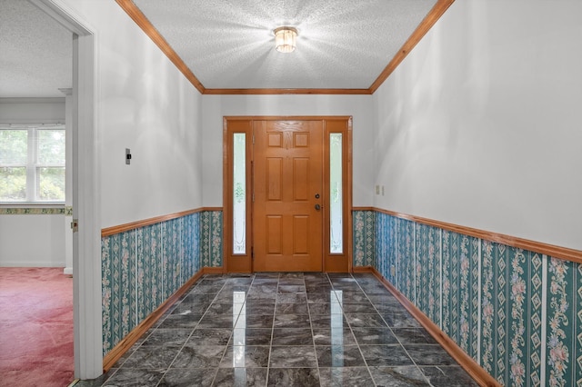 6601 Hunter Rd, Harrison, TN 37341 - foyer entrance with a textured ceiling, wallpapered walls, baseboards, crown molding, and a wainscoted wall