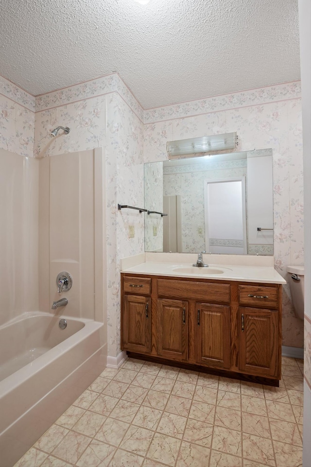 6601 Hunter Rd, Harrison, TN 37341 - bathroom featuring wallpapered walls, a textured ceiling, vanity, and bathtub / shower combination