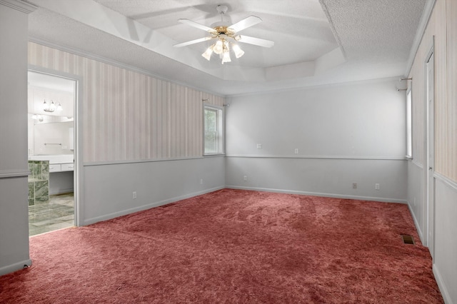 6601 Hunter Rd, Harrison, TN 37341 - carpeted empty room featuring a textured ceiling, ceiling fan, a raised ceiling, and baseboards