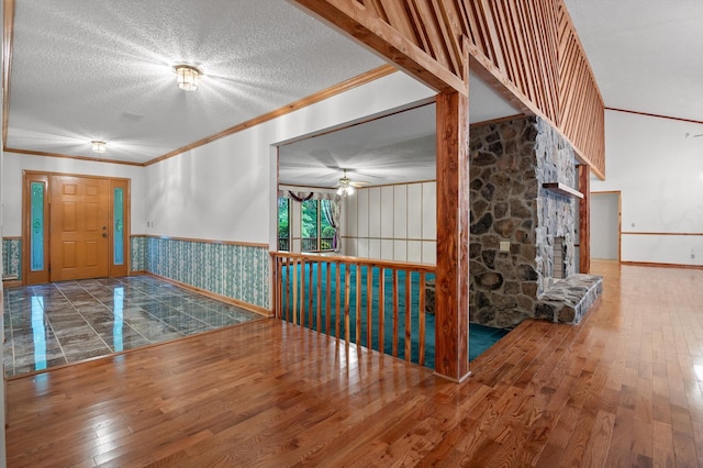 6601 Hunter Rd, Harrison, TN 37341 - foyer entrance with hardwood / wood-style flooring, crown molding, ceiling fan, a wainscoted wall, and a textured ceiling