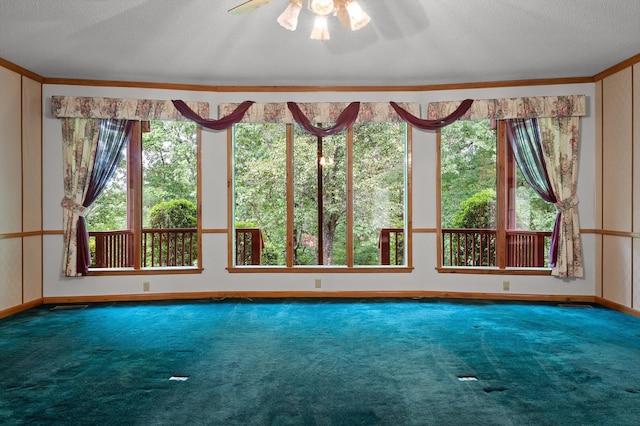 6601 Hunter Rd, Harrison, TN 37341 - unfurnished room featuring carpet, a ceiling fan, baseboards, crown molding, and a textured ceiling
