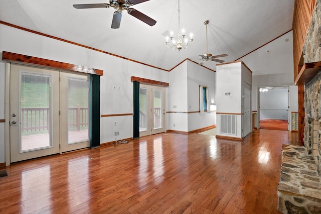 6601 Hunter Rd, Harrison, TN 37341 - unfurnished living room featuring ceiling fan, wood finished floors, high vaulted ceiling, a chandelier, and ornamental molding