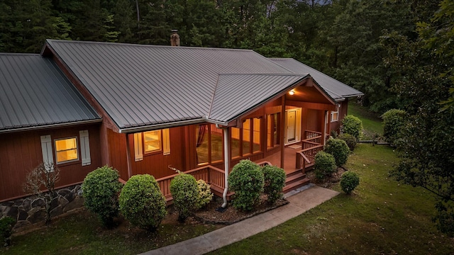 6601 Hunter Rd, Harrison, TN 37341 - view of front of house featuring a front lawn, metal roof, and a porch