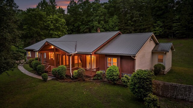 6601 Hunter Rd, Harrison, TN 37341 - view of front of property featuring covered porch, a front lawn, metal roof, and a chimney