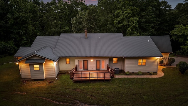 6601 Hunter Rd, Harrison, TN 37341 - rear view of house featuring a lawn, metal roof, a wooden deck, and crawl space