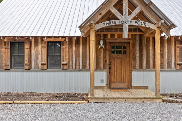 property entrance featuring metal roof