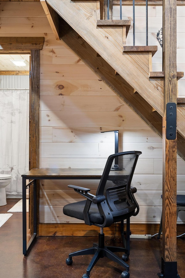 exercise room featuring wood walls