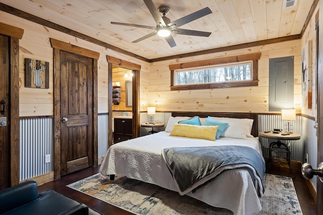 bedroom with wood walls, wood finished floors, wood ceiling, radiator heating unit, and electric panel