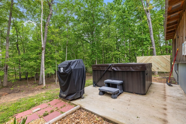 view of yard with a hot tub and a patio