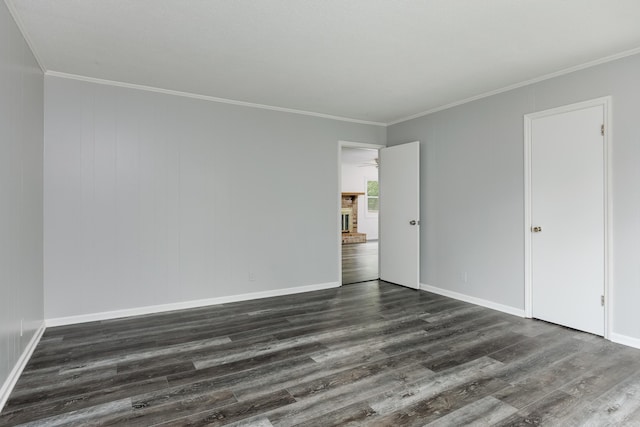 11306 Hixson Pike, Soddy Daisy, TN 37379 - unfurnished bedroom with dark wood finished floors, crown molding, and baseboards