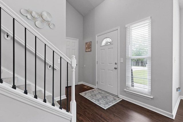 6837 Benwood Dr, Ooltewah, TN 37363 - foyer featuring dark wood finished floors, baseboards, stairway, and a high ceiling