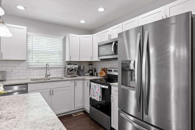 6837 Benwood Dr, Ooltewah, TN 37363 - kitchen with stainless steel appliances, a sink, recessed lighting, white cabinetry, and dark wood-style floors