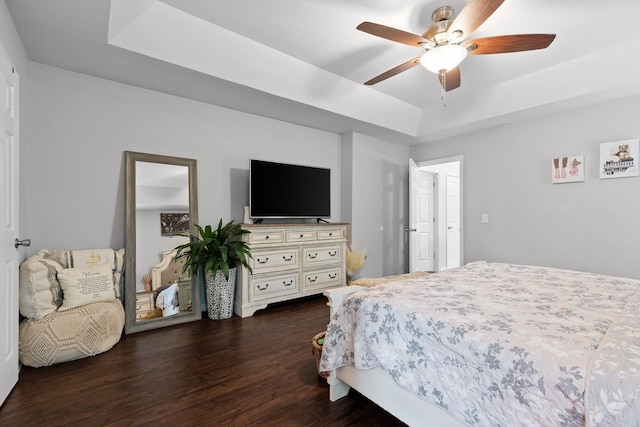 6837 Benwood Dr, Ooltewah, TN 37363 - bedroom with a tray ceiling, dark wood-type flooring, and a ceiling fan