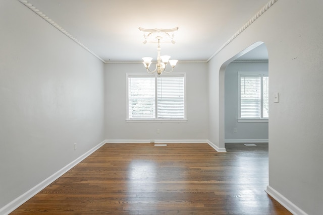 1641 John Ross Rd, Chattanooga, TN 37412 - spare room with arched walkways, a chandelier, ornamental molding, dark wood-type flooring, and baseboards