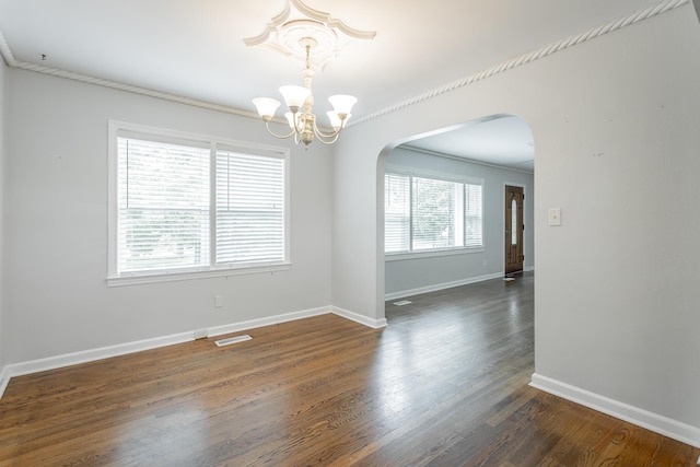1641 John Ross Rd, Chattanooga, TN 37412 - spare room featuring arched walkways, a chandelier, dark wood-style flooring, baseboards, and ornamental molding