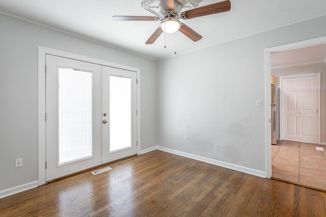 1641 John Ross Rd, Chattanooga, TN 37412 - empty room featuring french doors, ornamental molding, wood finished floors, and baseboards