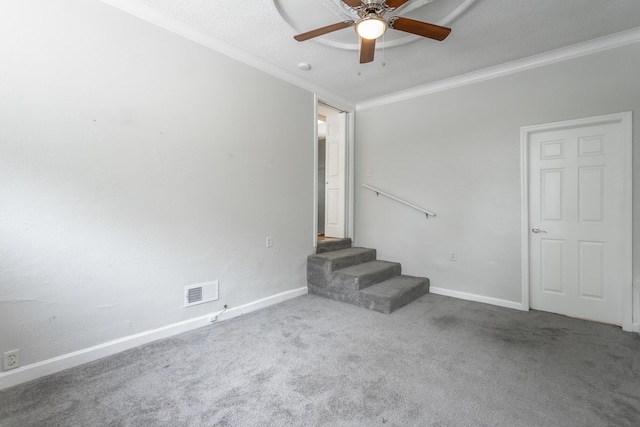 1641 John Ross Rd, Chattanooga, TN 37412 - carpeted empty room with ornamental molding, a ceiling fan, baseboards, and stairway
