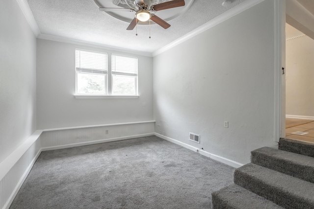 1641 John Ross Rd, Chattanooga, TN 37412 - carpeted empty room featuring a textured ceiling, ceiling fan, crown molding, and stairs