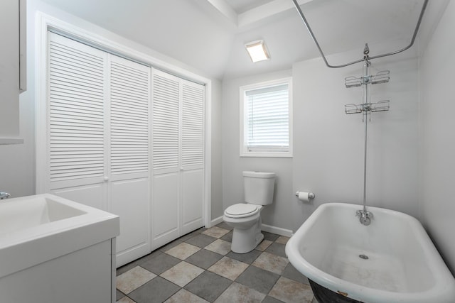 1641 John Ross Rd, Chattanooga, TN 37412 - bathroom with toilet, a freestanding tub, baseboards, and a shower