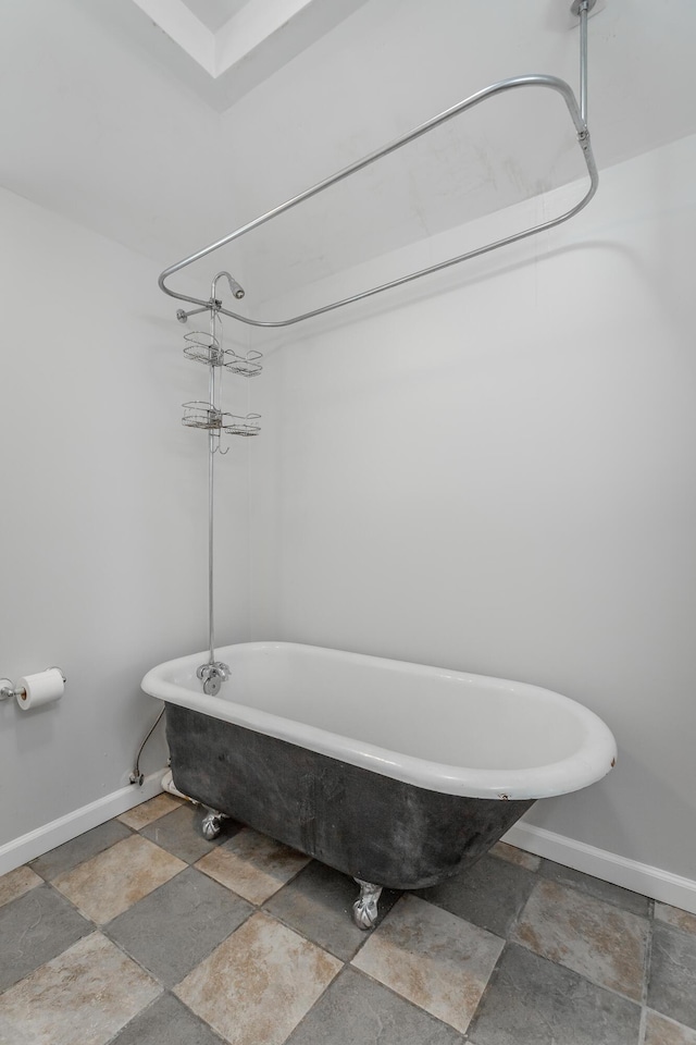 1641 John Ross Rd, Chattanooga, TN 37412 - full bath featuring stone tile flooring, baseboards, and a freestanding bath