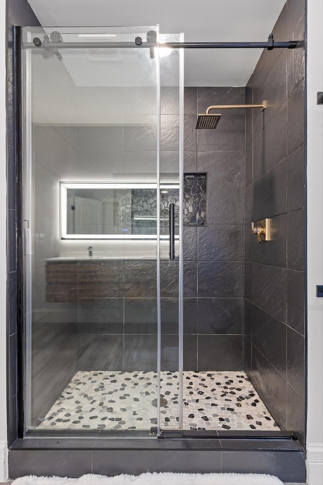 full bathroom featuring a stall shower
