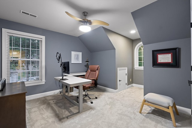 office space with carpet flooring, baseboards, a ceiling fan, and vaulted ceiling