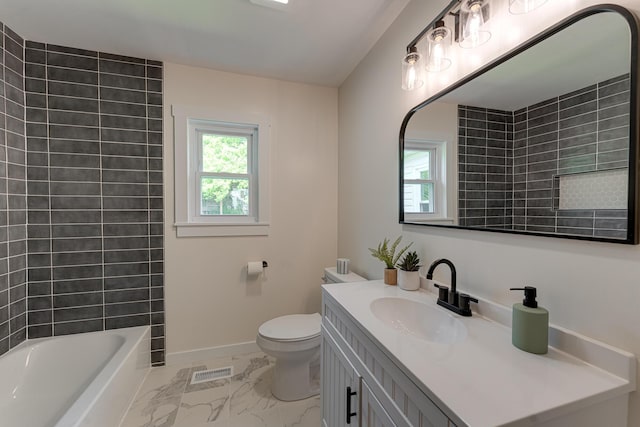 full bath featuring marble look tiles, healthy amount of natural light, toilet, and vanity