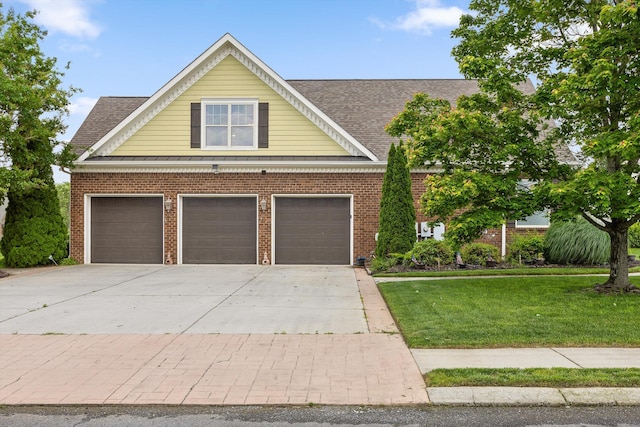 8109 Propeller Dr, Ooltewah, TN 37363 - view of front of house featuring concrete driveway, a front lawn, an attached garage, and brick siding