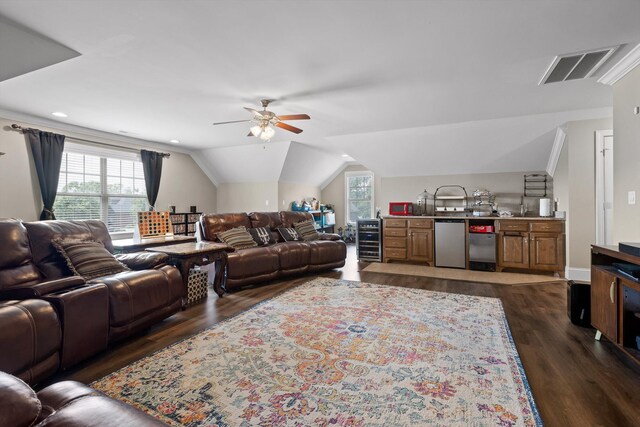 8109 Propeller Dr, Ooltewah, TN 37363 - living room with dark wood-style flooring, beverage cooler, ceiling fan, vaulted ceiling, and bar area
