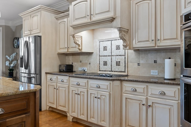 8109 Propeller Dr, Ooltewah, TN 37363 - kitchen with tasteful backsplash, stainless steel appliances, dark stone counters, light wood-type flooring, and crown molding