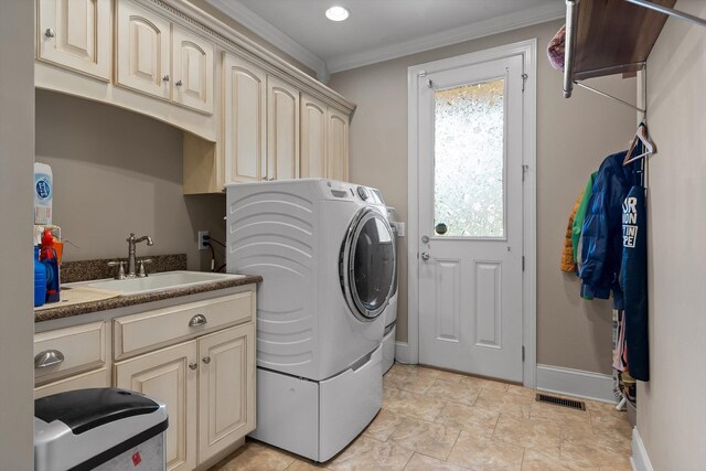 8109 Propeller Dr, Ooltewah, TN 37363 - clothes washing area featuring cabinet space, crown molding, baseboards, and washer and clothes dryer