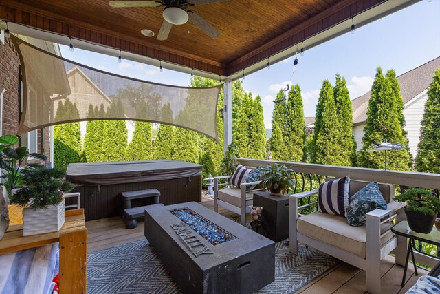 8109 Propeller Dr, Ooltewah, TN 37363 - deck featuring a hot tub, ceiling fan, and an outdoor living space with a fire pit