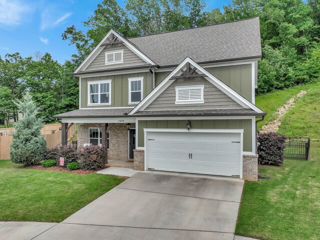 5479 Amber Grove Way, Hixson, TN 37343 - craftsman inspired home with board and batten siding, brick siding, driveway, a shingled roof, and a porch