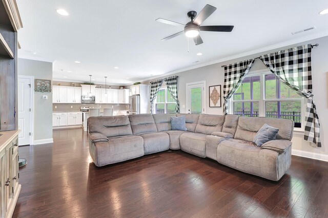5479 Amber Grove Way, Hixson, TN 37343 - living area with ornamental molding, plenty of natural light, ceiling fan, recessed lighting, and dark wood-type flooring