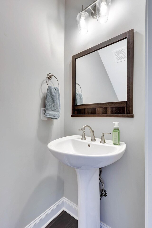 5479 Amber Grove Way, Hixson, TN 37343 - bathroom featuring baseboards and a sink
