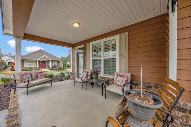 view of patio featuring a porch and a residential view