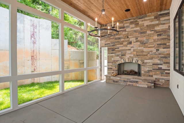 1608 Knickerbocker Ave, Chattanooga, TN 37405 - unfurnished sunroom featuring wood ceiling, finished concrete floors, and a chandelier
