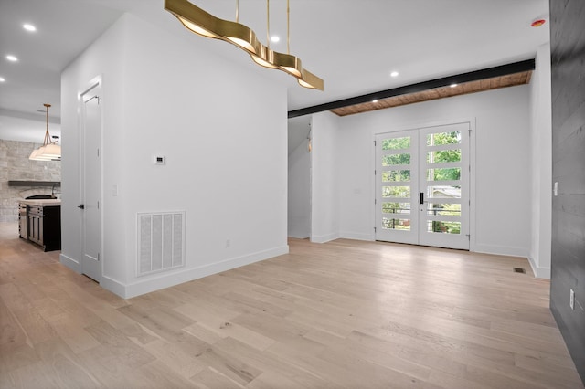 1608 Knickerbocker Ave, Chattanooga, TN 37405 - unfurnished living room with recessed lighting, light wood-style flooring, french doors, and baseboards