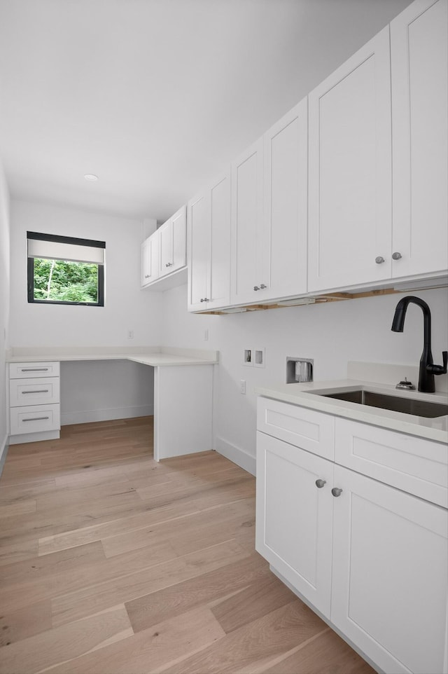 1608 Knickerbocker Ave, Chattanooga, TN 37405 - washroom with hookup for a washing machine, light wood-type flooring, baseboards, a desk, and hookup for an electric dryer