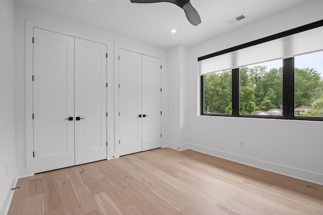 1608 Knickerbocker Ave, Chattanooga, TN 37405 - unfurnished bedroom with multiple closets, baseboards, light wood finished floors, recessed lighting, and a ceiling fan