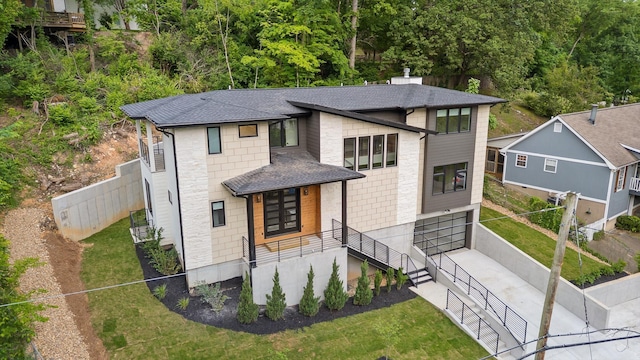 1608 Knickerbocker Ave, Chattanooga, TN 37405 - view of front facade featuring driveway, a shingled roof, a garage, and stone siding