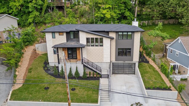 1608 Knickerbocker Ave, Chattanooga, TN 37405 - view of front of house featuring concrete driveway, an attached garage, a shingled roof, and stairway